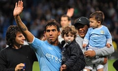Manchester City's Carlos Tevez waves to fans