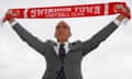 Paolo Di Canio holds aloft a Swindon Town scarf as he is unveiled as their new manager