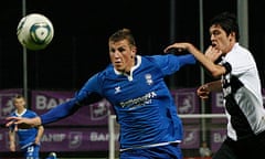 Birmingham City's Wood fights for the ball with Nacional's Felipe Lopes