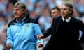 Manchester City's Brian Kidd and Roberto Mancini