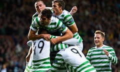 Celtic's Gary Hooper is smothered by team-mates as they celebrate his goal against Helsingborg.