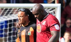 Barnet's Edgar Davids, left, is comforted by Northampton Town's Adebayo Akinfenwa after relegation