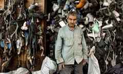 Mahmoud Mohammed Imad in front of his curtain made of garbage in Jabaliya Refugee Camp