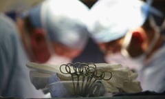 NHS: Surgeons at The Queen Elizabeth Hospital Birmingham conduct an operation