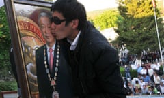 A supporter of the ousted president Kurmanbek Bakiyev kisses his portrait in Jalal-Abad, Kyrgyzstan,