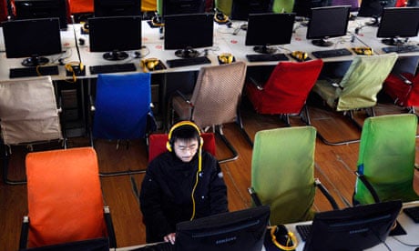 A customer uses computer in an internet cafe at Changzhi