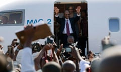 Haiti's former president, Jean-Bertrand Aristide, with his wife Mildred arrives in Port-au-Prince