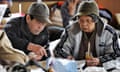 People eat at an evacuation centre in Ishinomaki, Miyagi prefecture