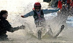 The 2011 spring ski season has a lot to offer. A young skier tries to skim across a pond in a sprin