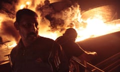 A fuel depot in Misrata burns after a bombing raid by Gaddaffi troops