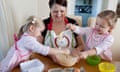 Emma Trappett baking with her four-year-old twins Sienna (left) and Jessica.