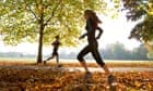 Young woman and man running.