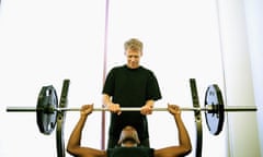 Man works out with trainer 