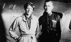 Amelia Earhart and Fred Noonan, her navigator, in front of their twin-engine Lockheed Electra in May