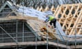 House building: builder on roof