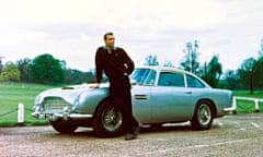 James Bond, played by Sean Connery, with the character’s Aston Martin DB5 on the set of Goldfinger