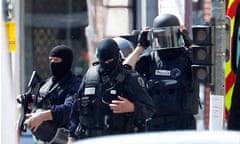French police commandos after raid on bank where man claiming links to al-Qaida seized hostages