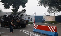 Indian workers remove a barrier outside the US embassy over the alleged mistreatment of Khobragade