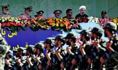 Iran's pragmatic new president, Hassan Rouhani reviews military forces at a parade in Tehran