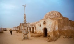 Arab man walking in the remains of the Star Wars set now a tourist attraction in the Tunisian desert