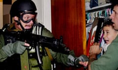 Elian Gonzalez, held by Donato Dalrymple, is taken by U.S. federal agents