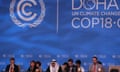 Delegates attend the last day of the UN climate talks in Doha