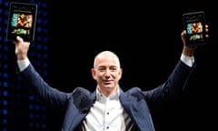 Jeff Bezos holds new Kindle products