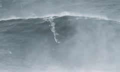 Garrett McNamara surfing a giant wave in Nazaré Portugal