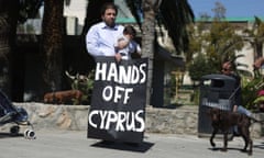 Cypriots protest outside the parliament