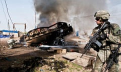 US soldiers arrive at the scene of a Bradley vehicle that has blown up