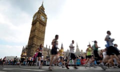 Competitors run past Houses of Parliament during 2011 London Marathon