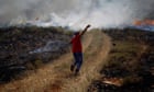 Palestinian protester throws stones at Israeli troops during clashes near the village of Deir Jarir