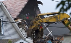 A crane demolishes the home of Ariel Castro