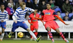 Bolton Wanderers' David N'Gog (L) in action with Reading's Hope Akpan
