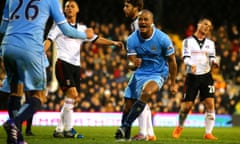 Vincent Kompany of Manchester City celebrates scoring their second goal with Martin Demichelis of Ma