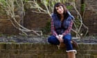 Comedian Isy Suttie sitting on a wall