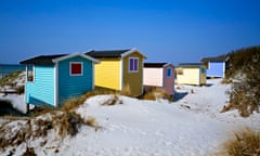 Sweden: Colourful beach changerooms on the Skåne coastline