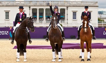 Team GB get their gold medals on their horses. 