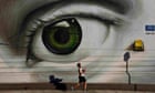 Athens, Greece: A boy walks by graffiti in the Tavros neighbourhood