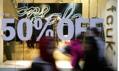  Winter sale signs in a French Connection shop window. Photograph: Frank Baron