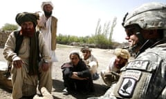 US soldiers from Charlie Company, 173rd Brigade (Airborne) are greeted by the elder of the town of Mangritay, Afghanistan