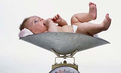 A baby on a weighing scale