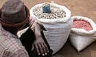 A man selling beans at Katine market