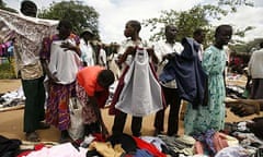 People buying clothes at the Katine market