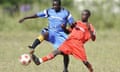 Opuyo Super Eagles (blue) play Omodoi Reds FC in the Katine 09 football tournament