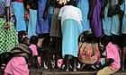 Children in Katine trying to get a better view at an annual music and dance festival for the schools of the area