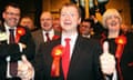 Labour candidate Willie Bain gives thumbs-up as he wins Glasgow North East byelection