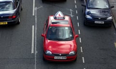 a driving instructor teaching a student