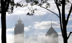 Fog clears from skyscrapers in Perth. Photograph: Gregg Wood/AFP/Getty Images