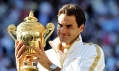 Roger Federer holds the trophy after beating Andy Roddick in the men's final at Wimbledon